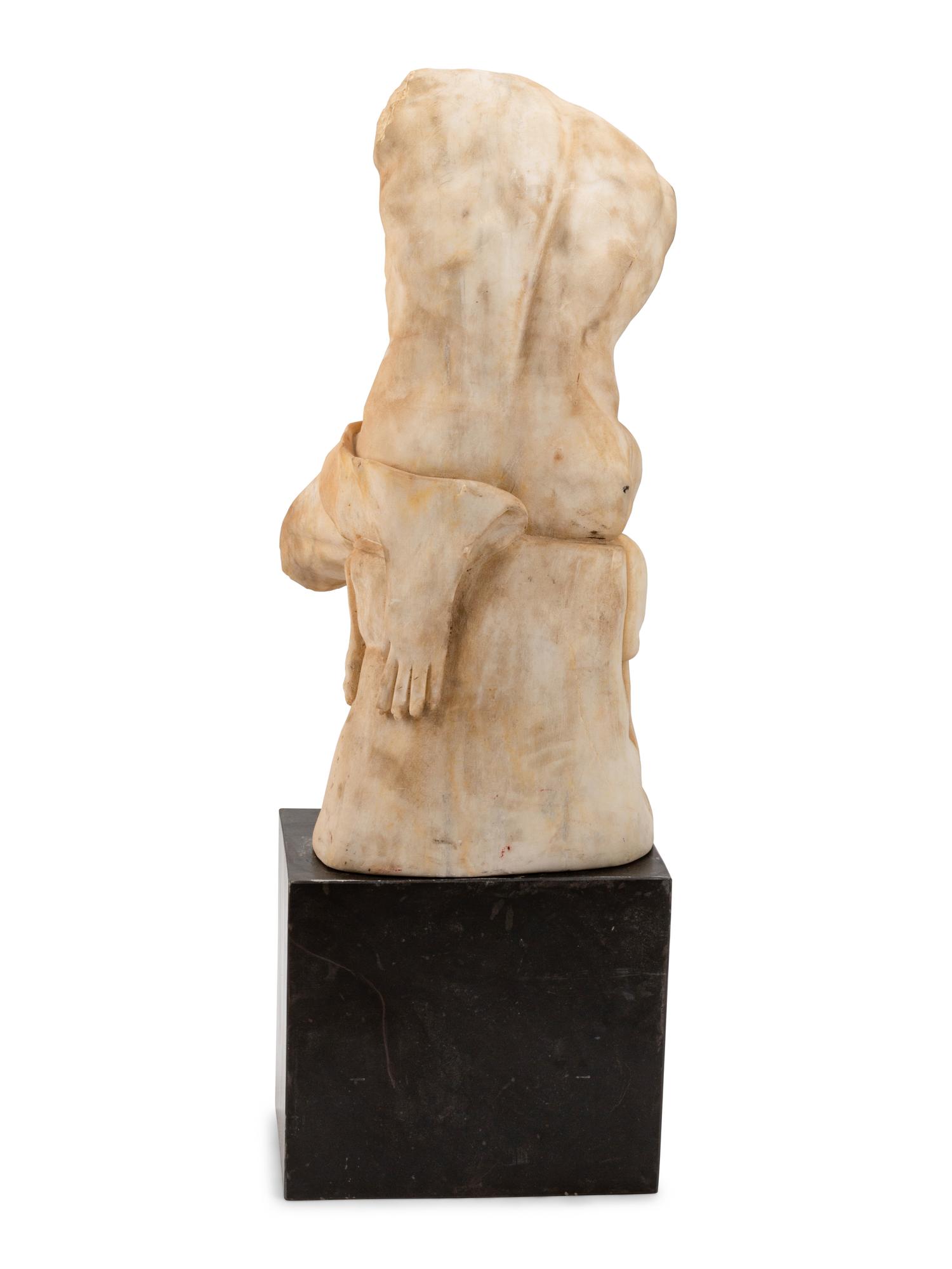 A Continental Marble Male Torso After the Antique