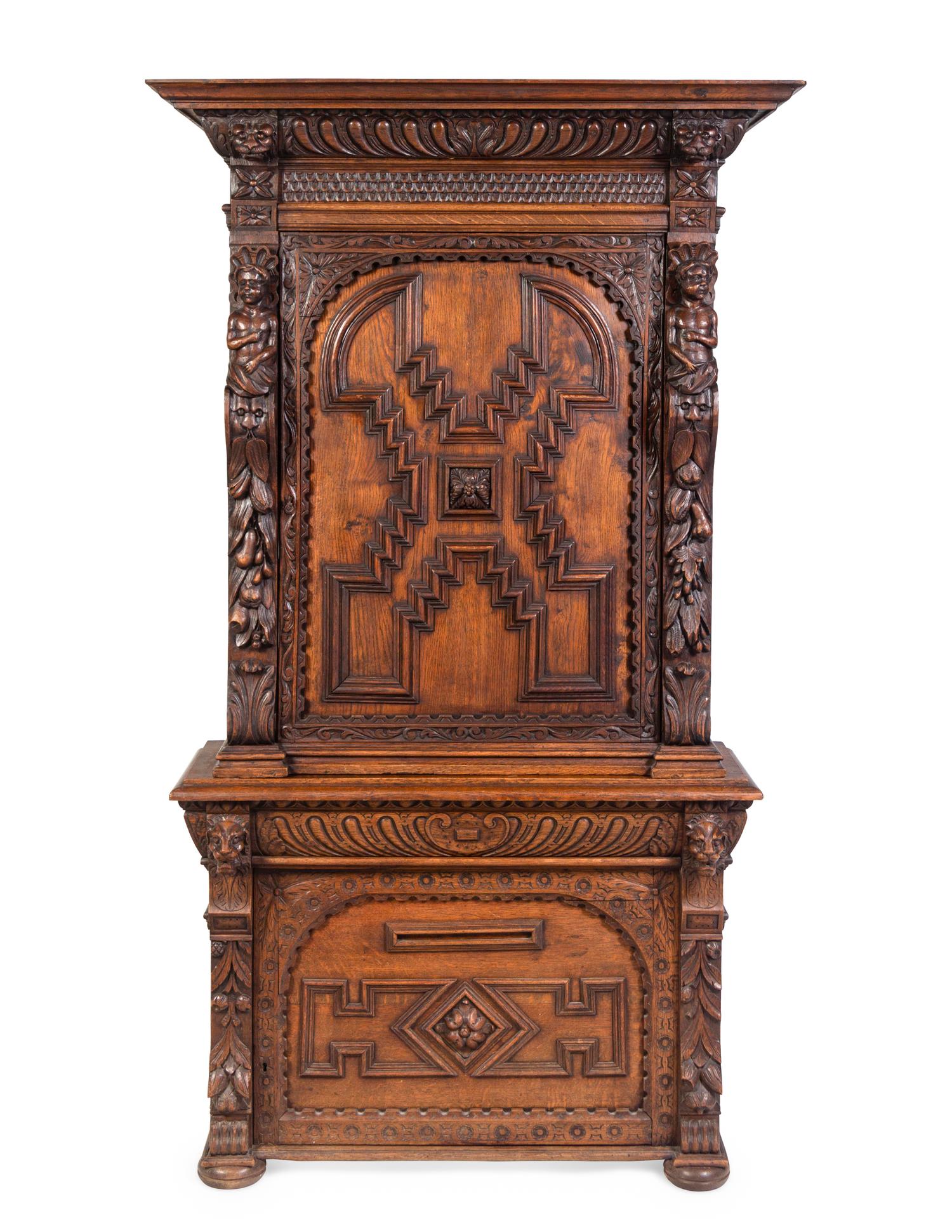 An Italian Renaissance Revival Carved Oak Cabinet