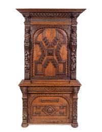 An Italian Renaissance Revival Carved Oak Cabinet