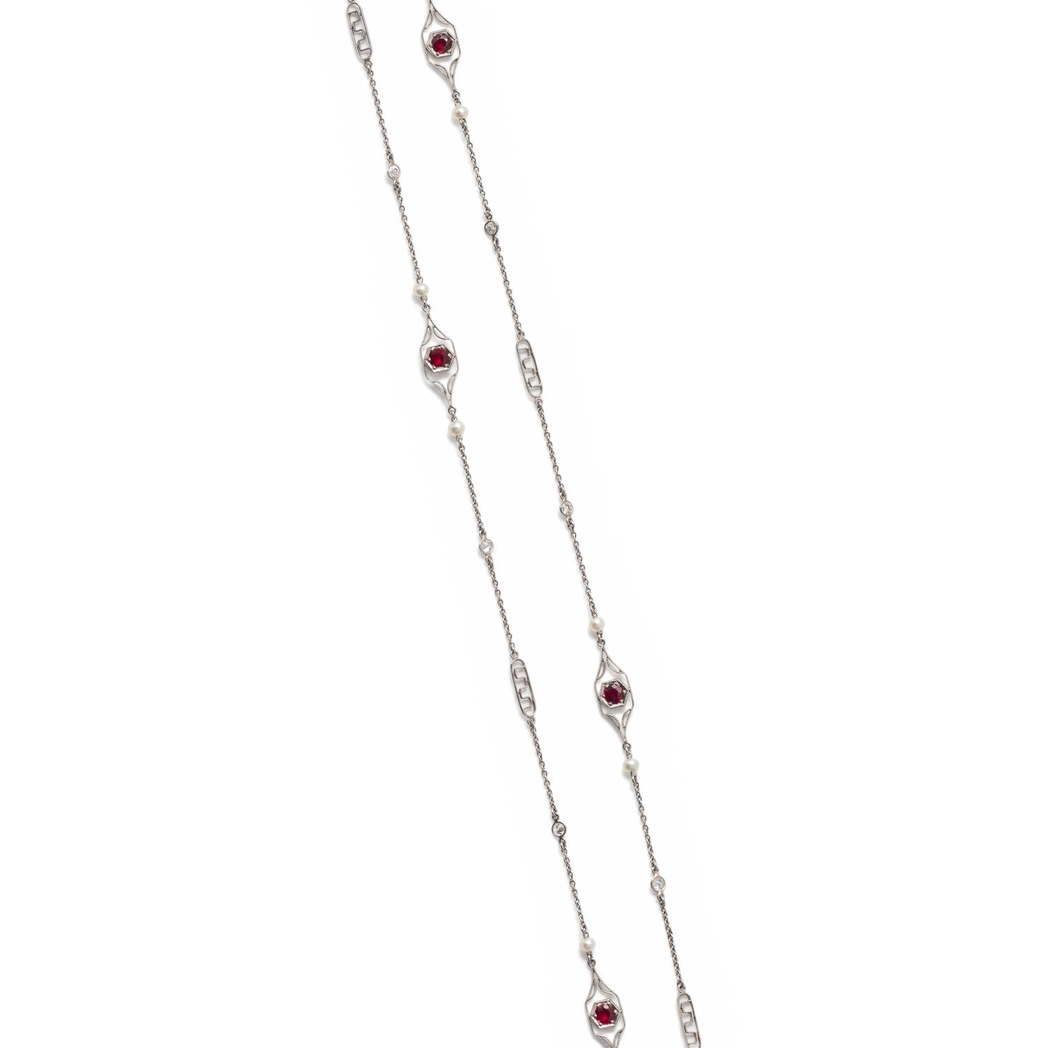PLATINUM, DIAMOND, SEED PEARL AND SYNTHETIC RUBY LONGCHAIN NECKLACE