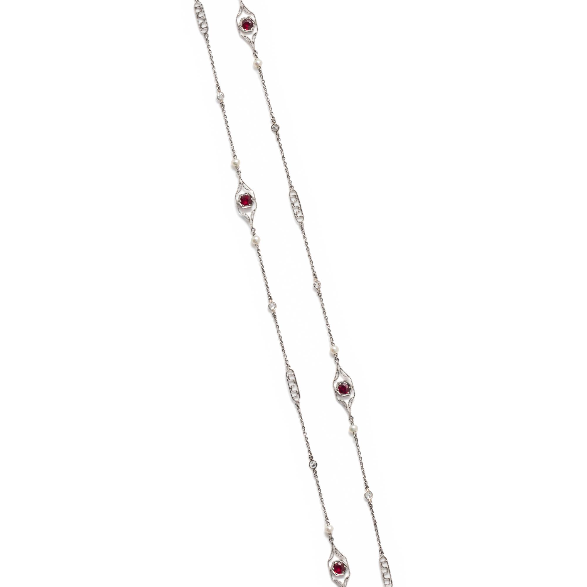 PLATINUM, DIAMOND, SEED PEARL AND SYNTHETIC RUBY LONGCHAIN NECKLACE