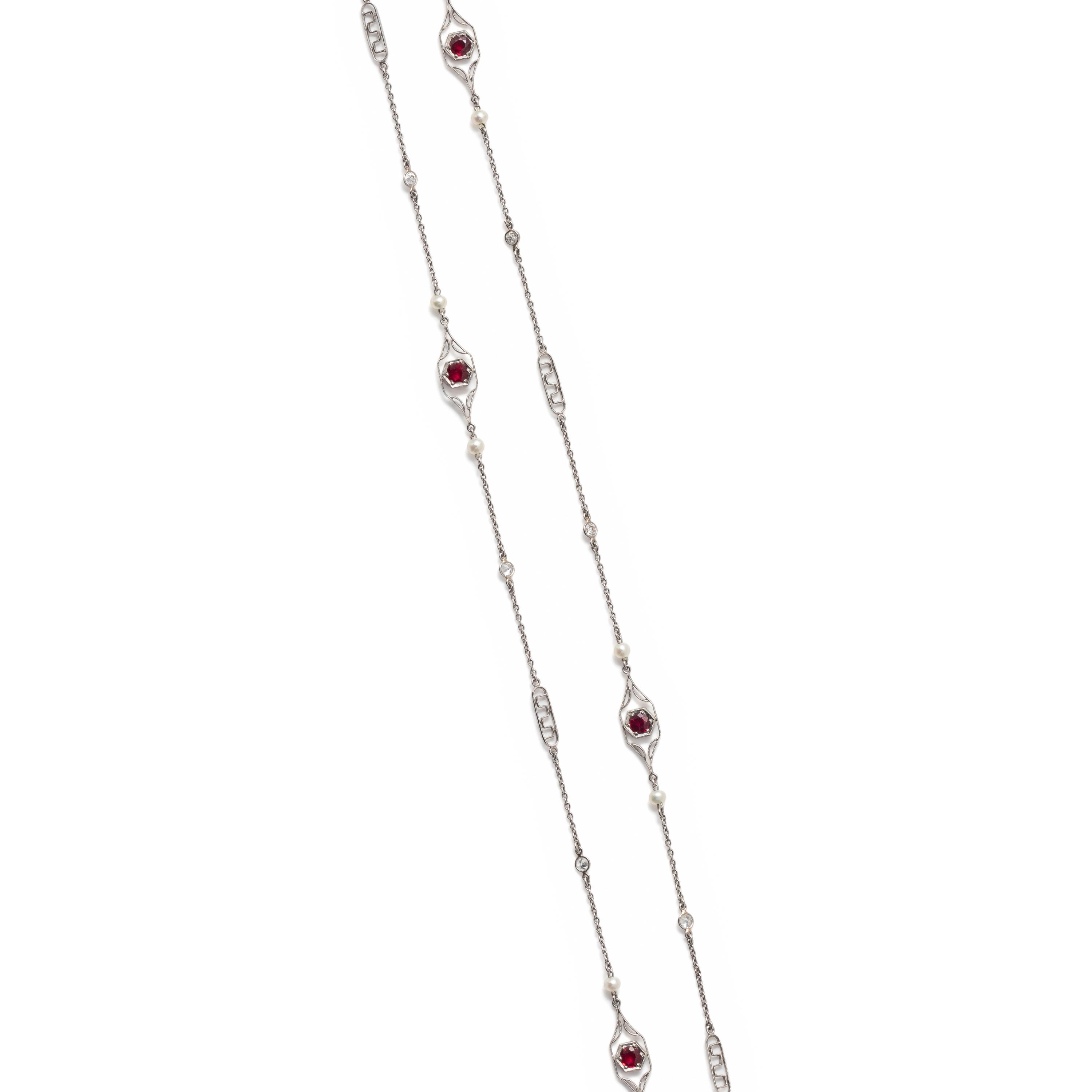 PLATINUM, DIAMOND, SEED PEARL AND SYNTHETIC RUBY LONGCHAIN NECKLACE