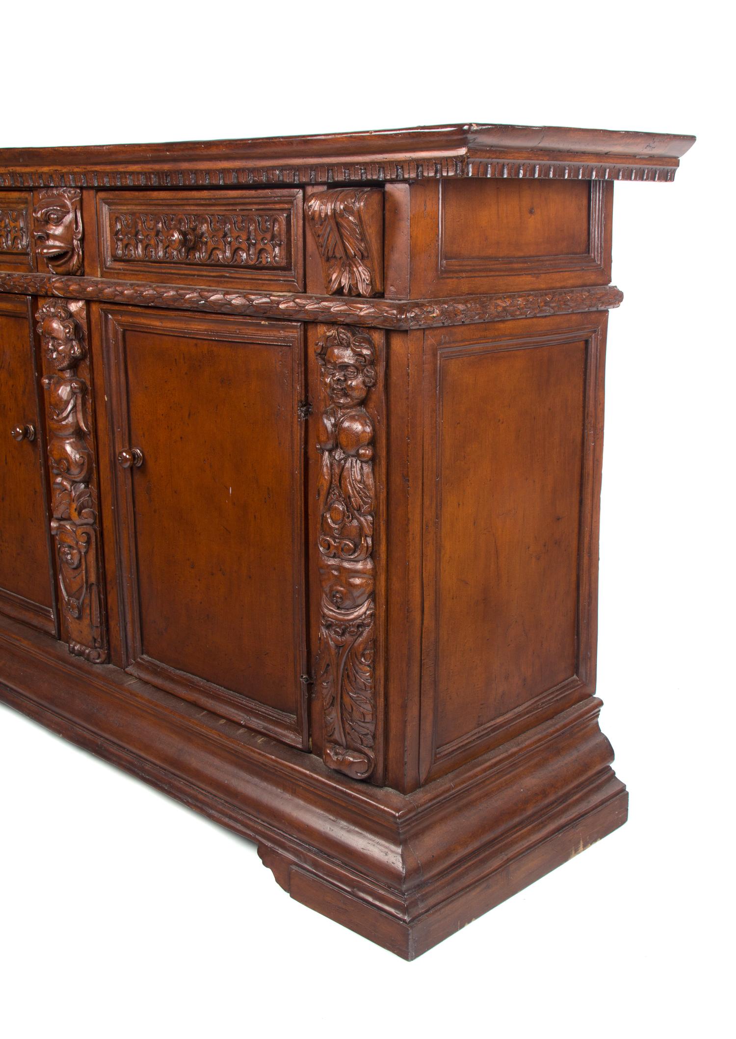 A Jacobean Style Walnut Server Height 44 x width 70 3/4 x depth 20 3/4 inches.