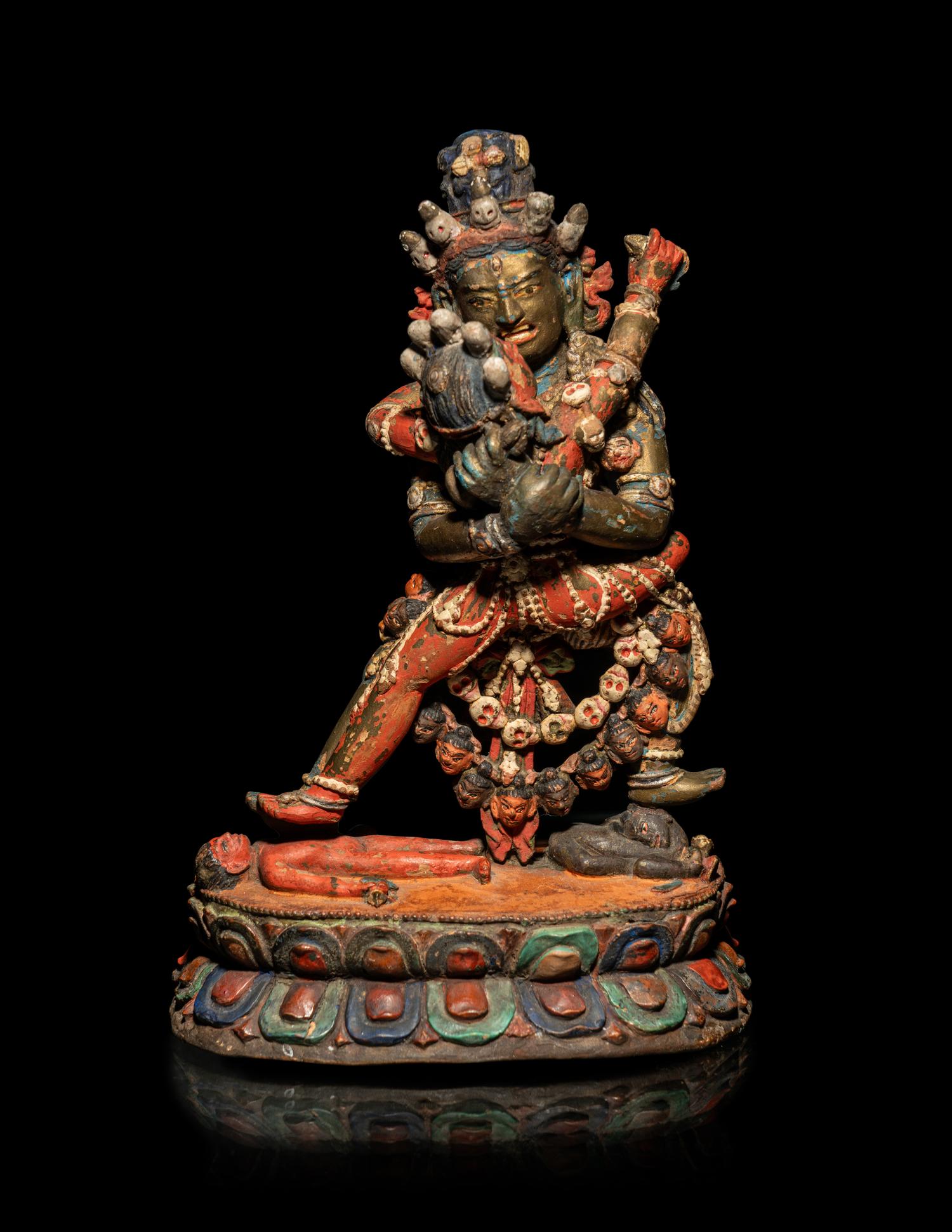 A Tibetan or Bhutanese Polychromed Wood Figure of Chakrasamvara and Consort