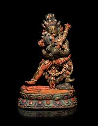 A Tibetan or Bhutanese Polychromed Wood Figure of Chakrasamvara and Consort