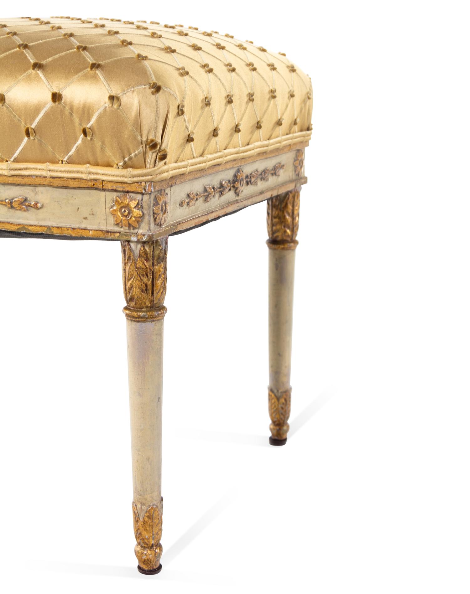 A Pair of Italian White-Painted and Parcel Gilt Carved Benches