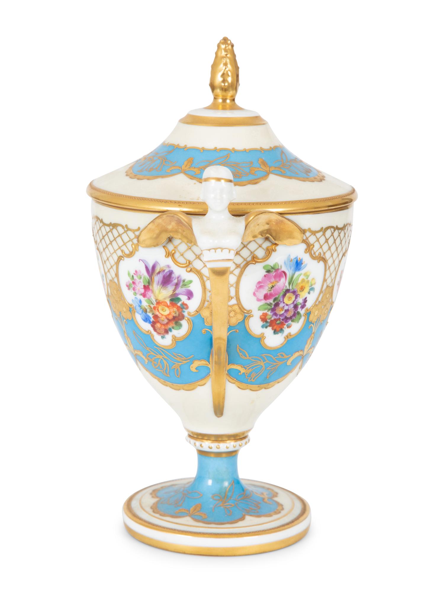 A Fürstenberg Porcelain Gilded Two-Handled Figural Urn