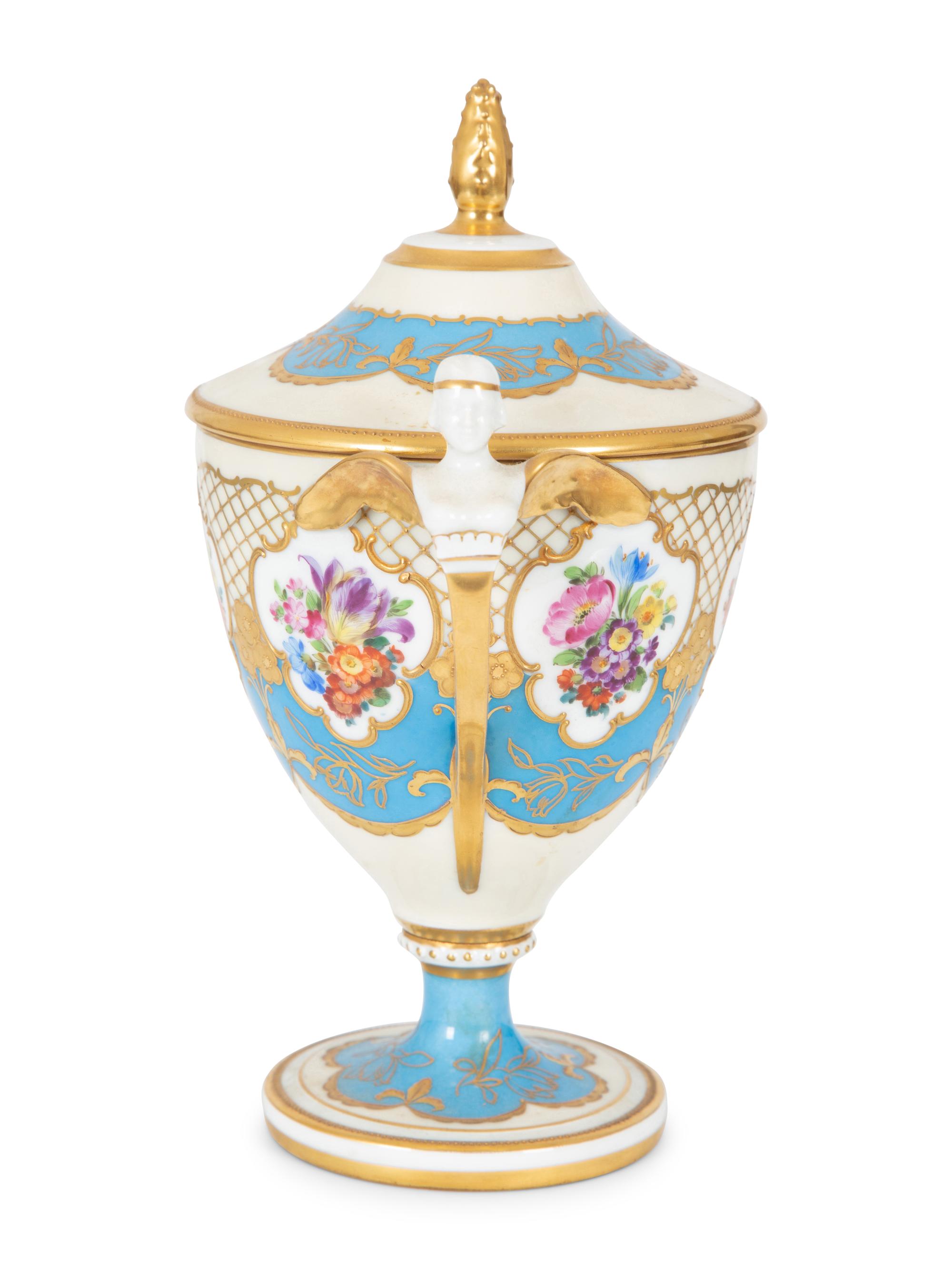 A Fürstenberg Porcelain Gilded Two-Handled Figural Urn