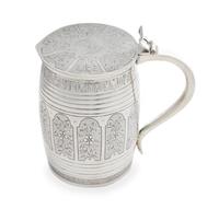 A Russian Silver Tankard, Mark of Michael Karpinsky, Assay of Viktor Savinsky, Moscow, 1868, the lid worked to show shaped panels enclo