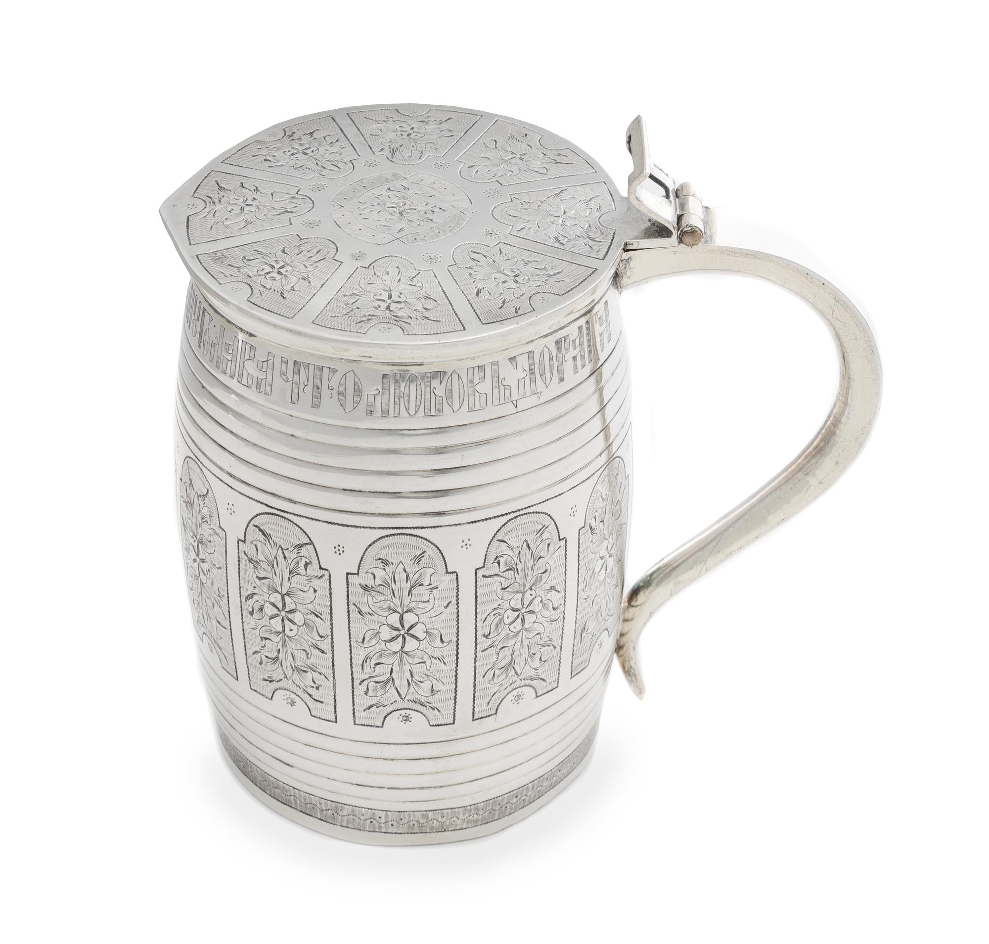 A Russian Silver Tankard, Mark of Michael Karpinsky, Assay of Viktor Savinsky, Moscow, 1868, the lid worked to show shaped panels enclo