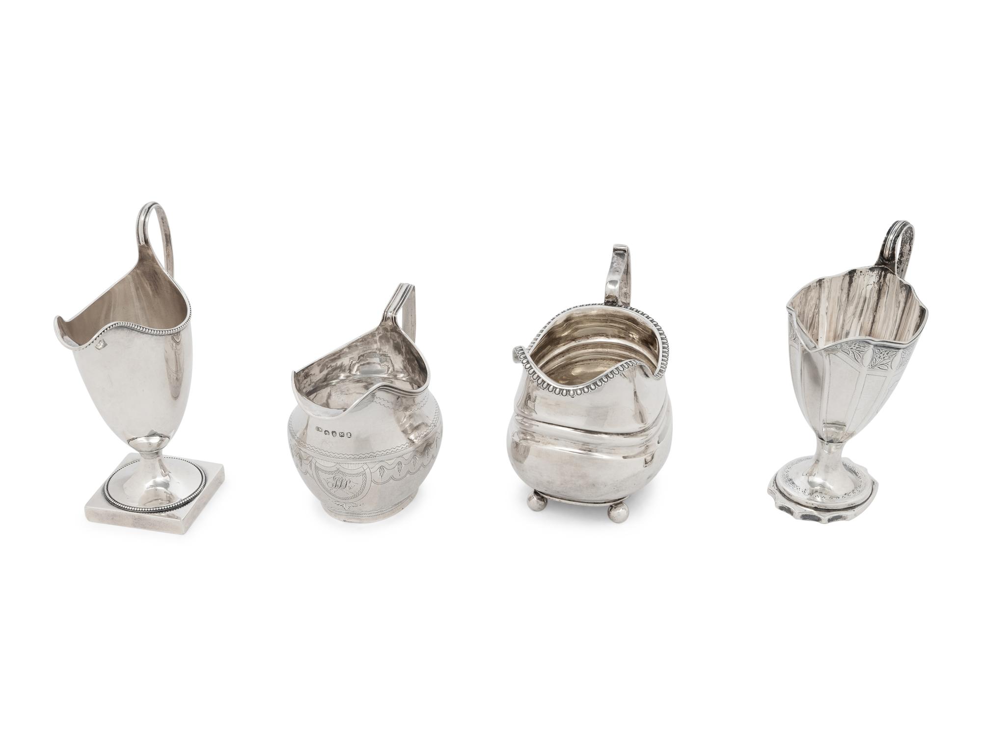 A Group of Four English Silver Creamers
