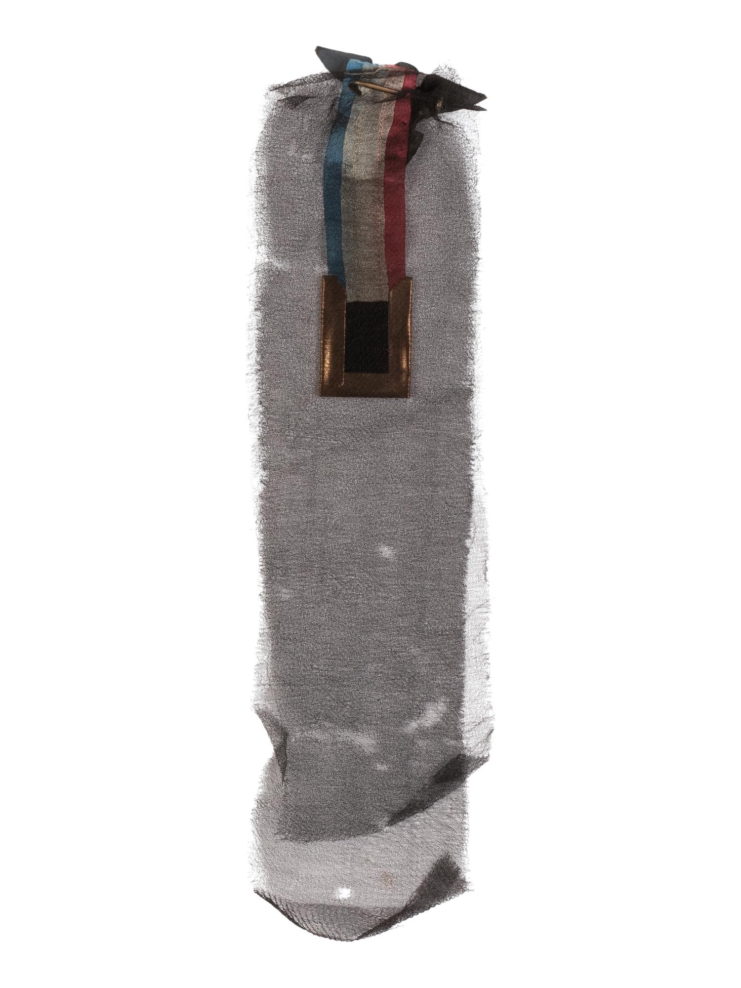 [LINCOLN'S FUNERAL]. A mourning badge with ferrotype image of Abraham Lincoln, ca. 19 April 1865.