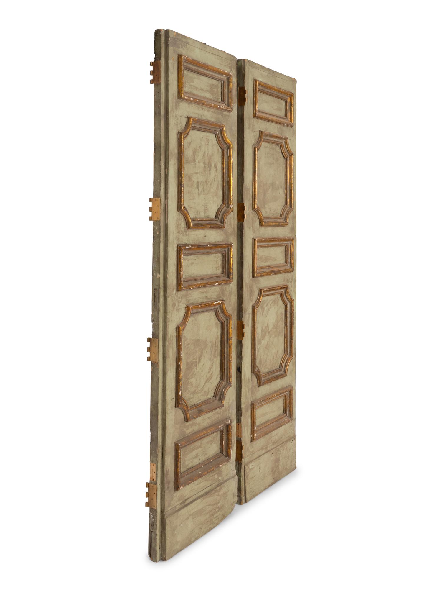 A Pair of Large Italian Blue Painted and Parcel Gilt Doors