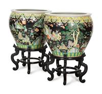 A Pair of Large Famille Noir Porcelain Fish Bowls on Teak Stands