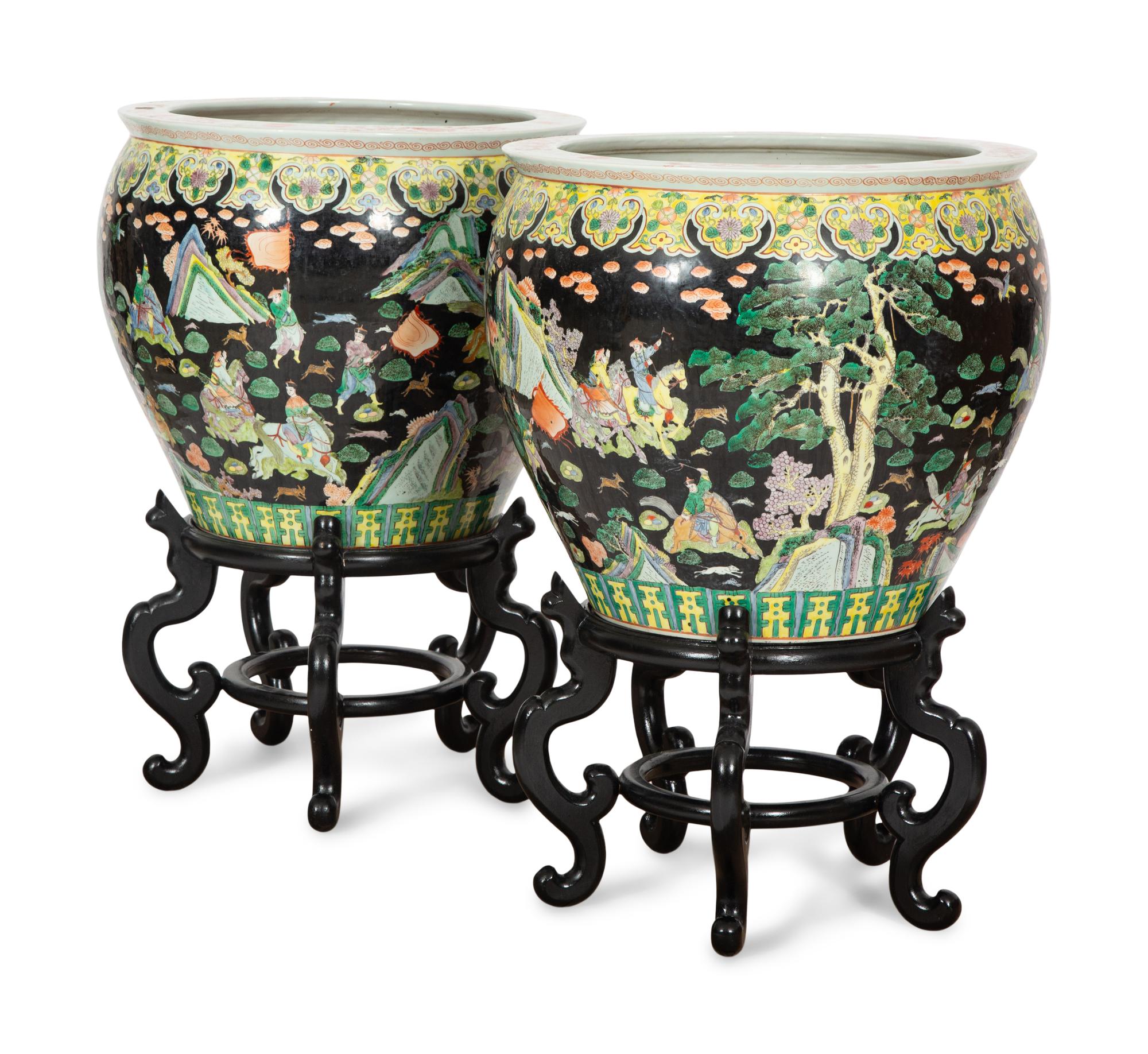 A Pair of Large Famille Noir Porcelain Fish Bowls on Teak Stands
