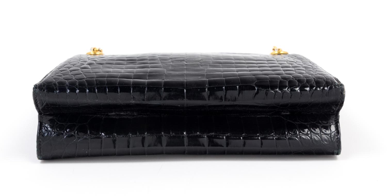 A Gucci Black Crocodile Handbag, 9.5" x 7.5" x 2.5"; Strap drop: 5.5".