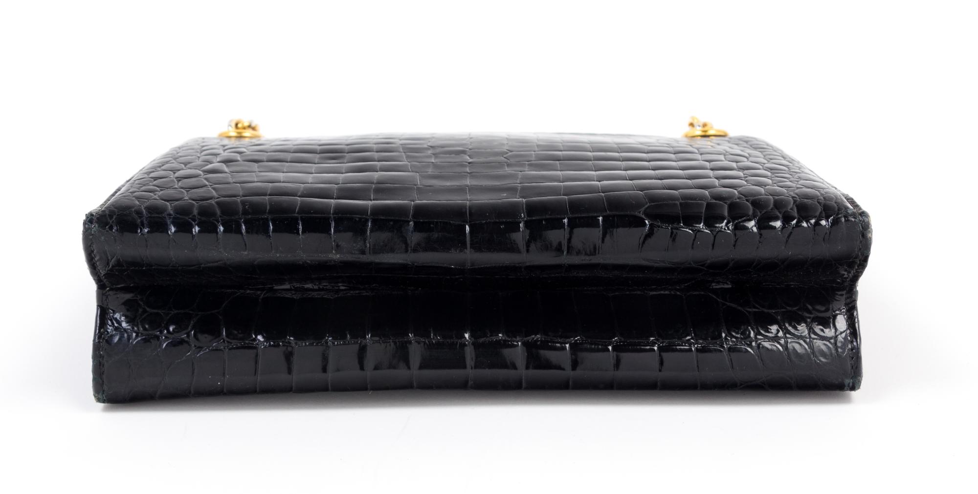 A Gucci Black Crocodile Handbag, 9.5" x 7.5" x 2.5"; Strap drop: 5.5".
