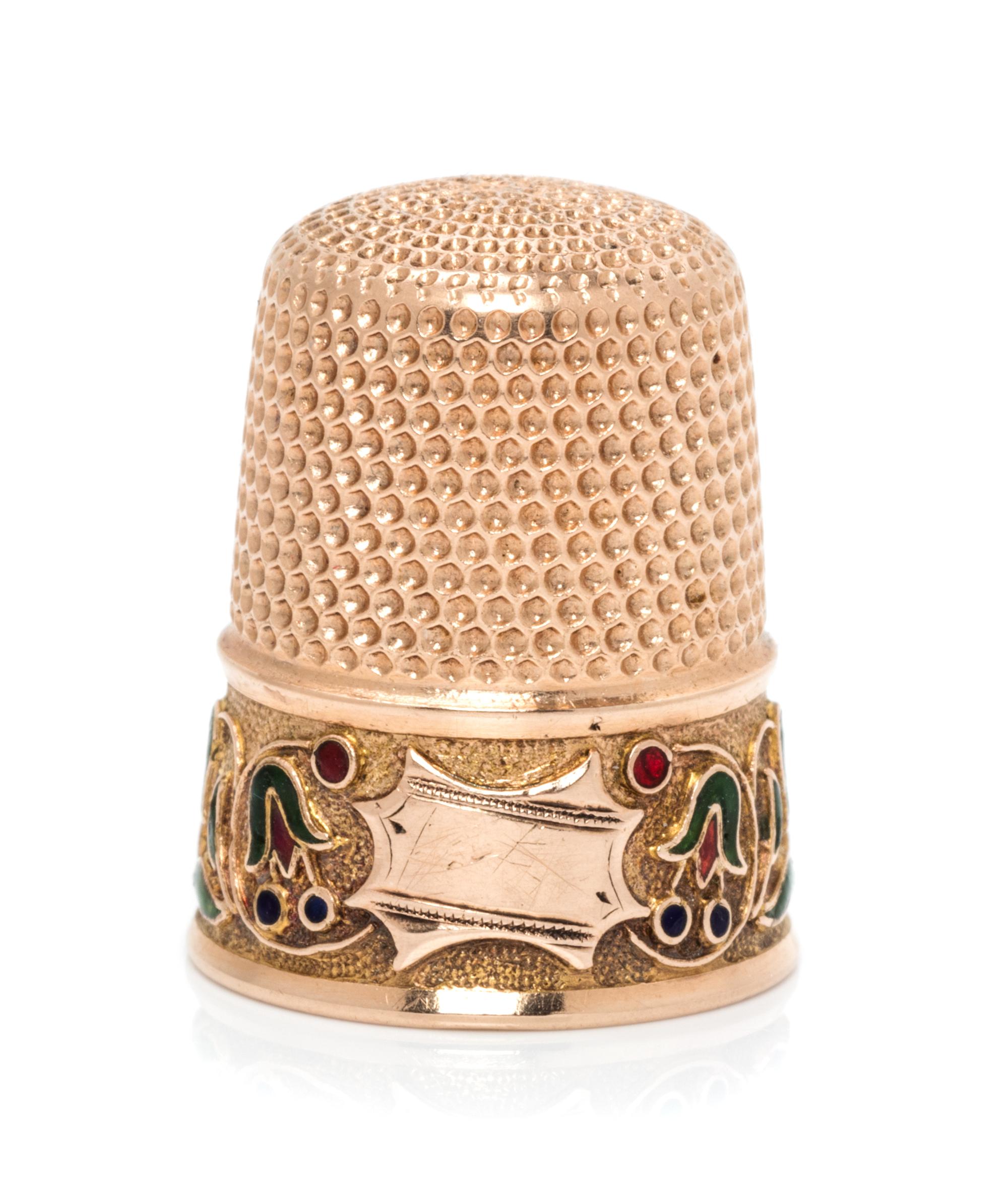 An American 14-Karat Gold and Enamel Thimble, Simons Bros., Philadelphia, PA, the knurled top and body above a polychrome enamel floral