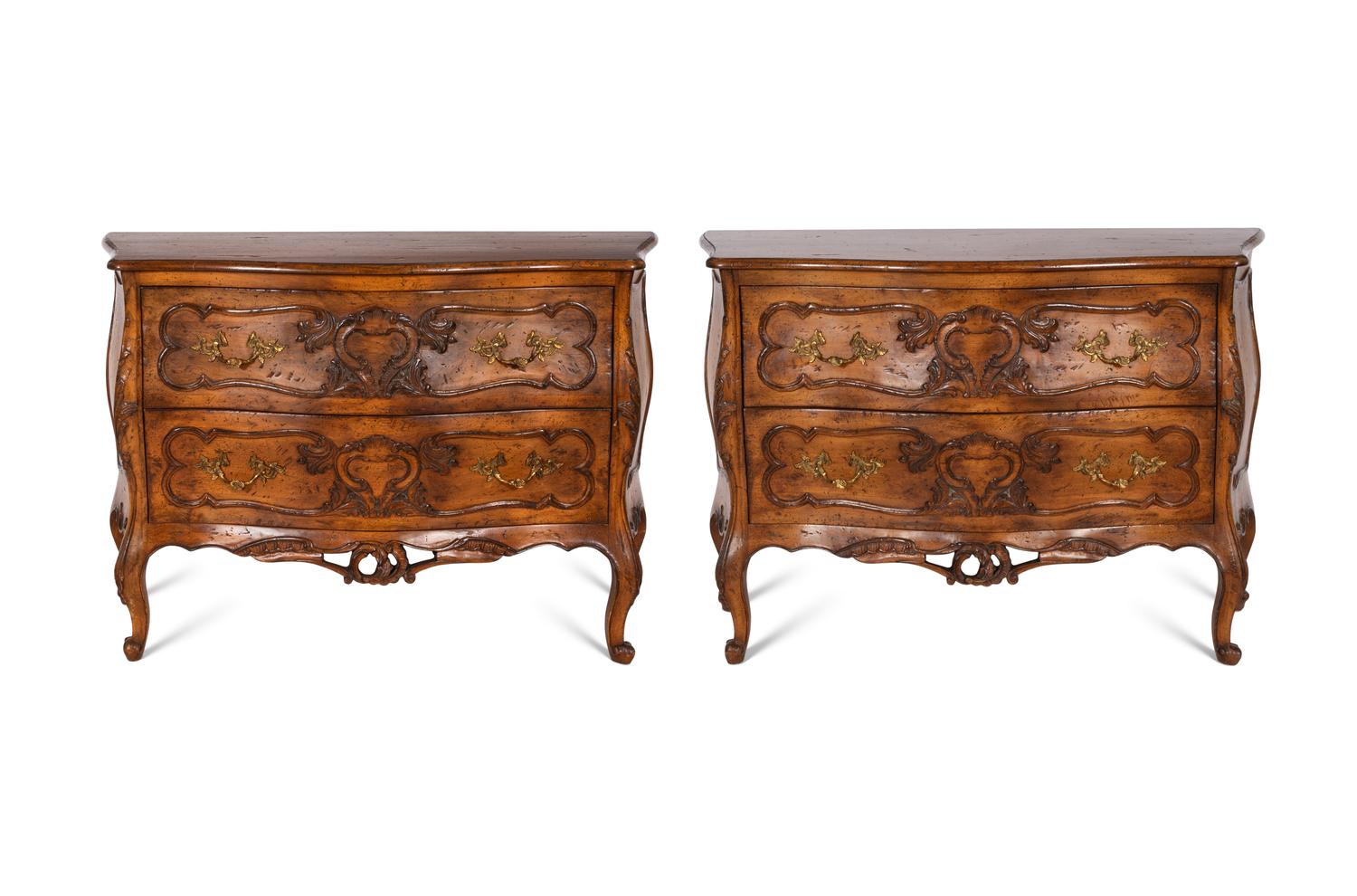 A Pair of Louis XV Style Walnut Bombé Form Commodes