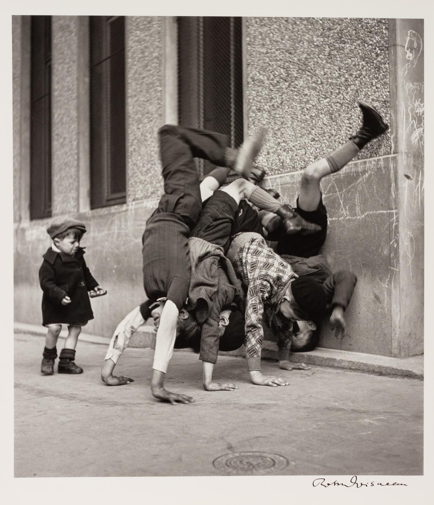 A pair of photographs ( Trois Petits Enfants Blancs , 1971; Les Pieds Aux Murs , 1934)
