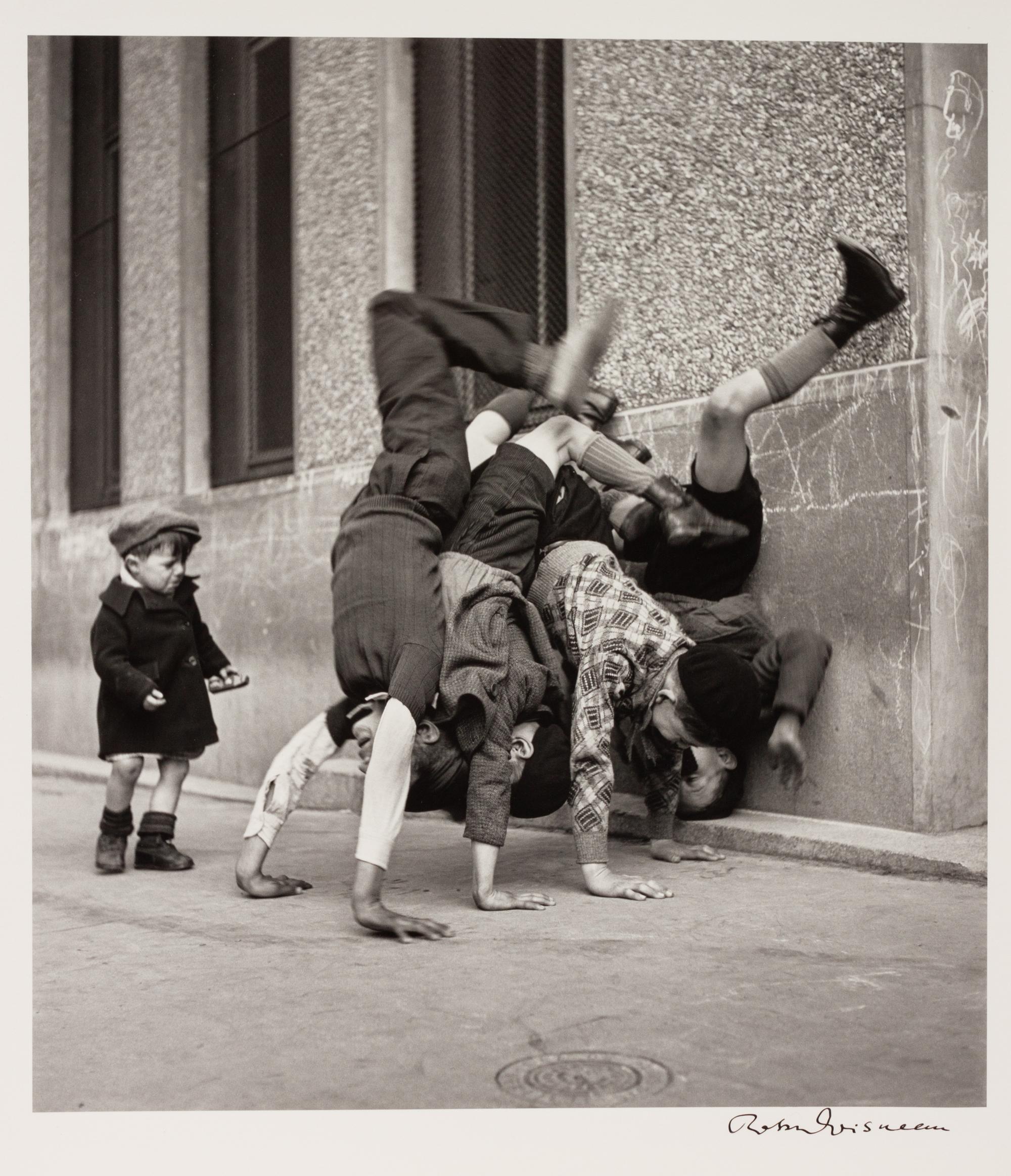 A pair of photographs ( Trois Petits Enfants Blancs , 1971; Les Pieds Aux Murs , 1934)