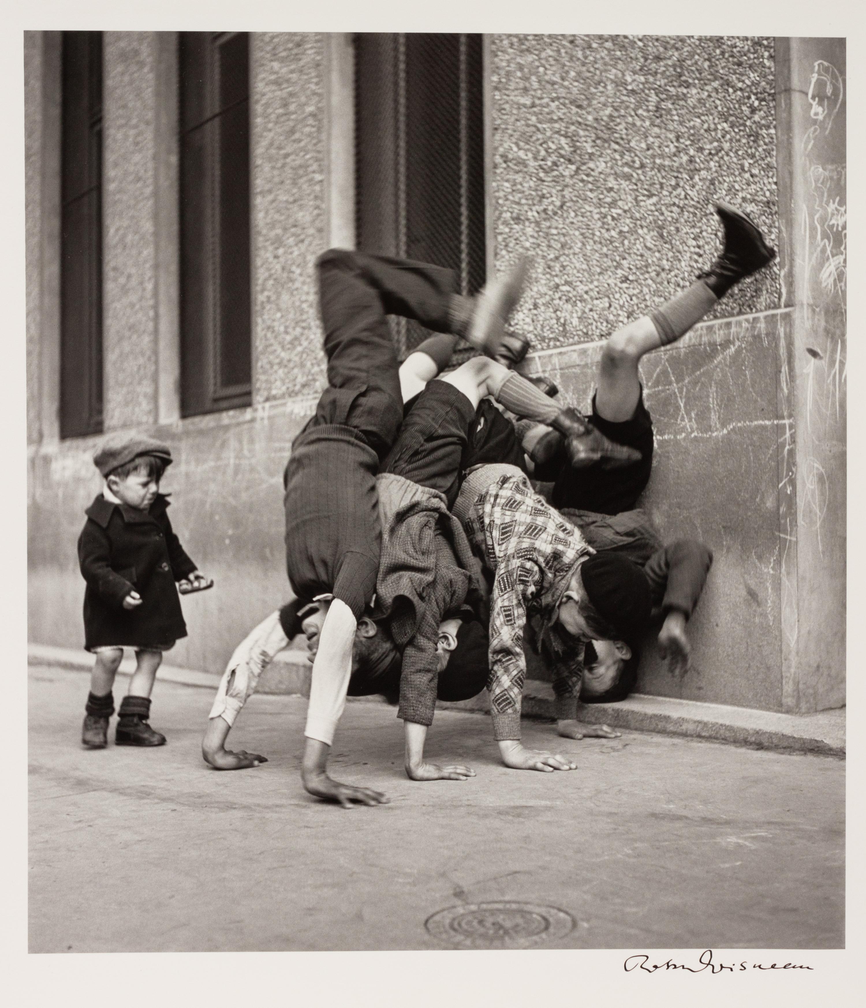 A pair of photographs ( Trois Petits Enfants Blancs , 1971; Les Pieds Aux Murs , 1934)