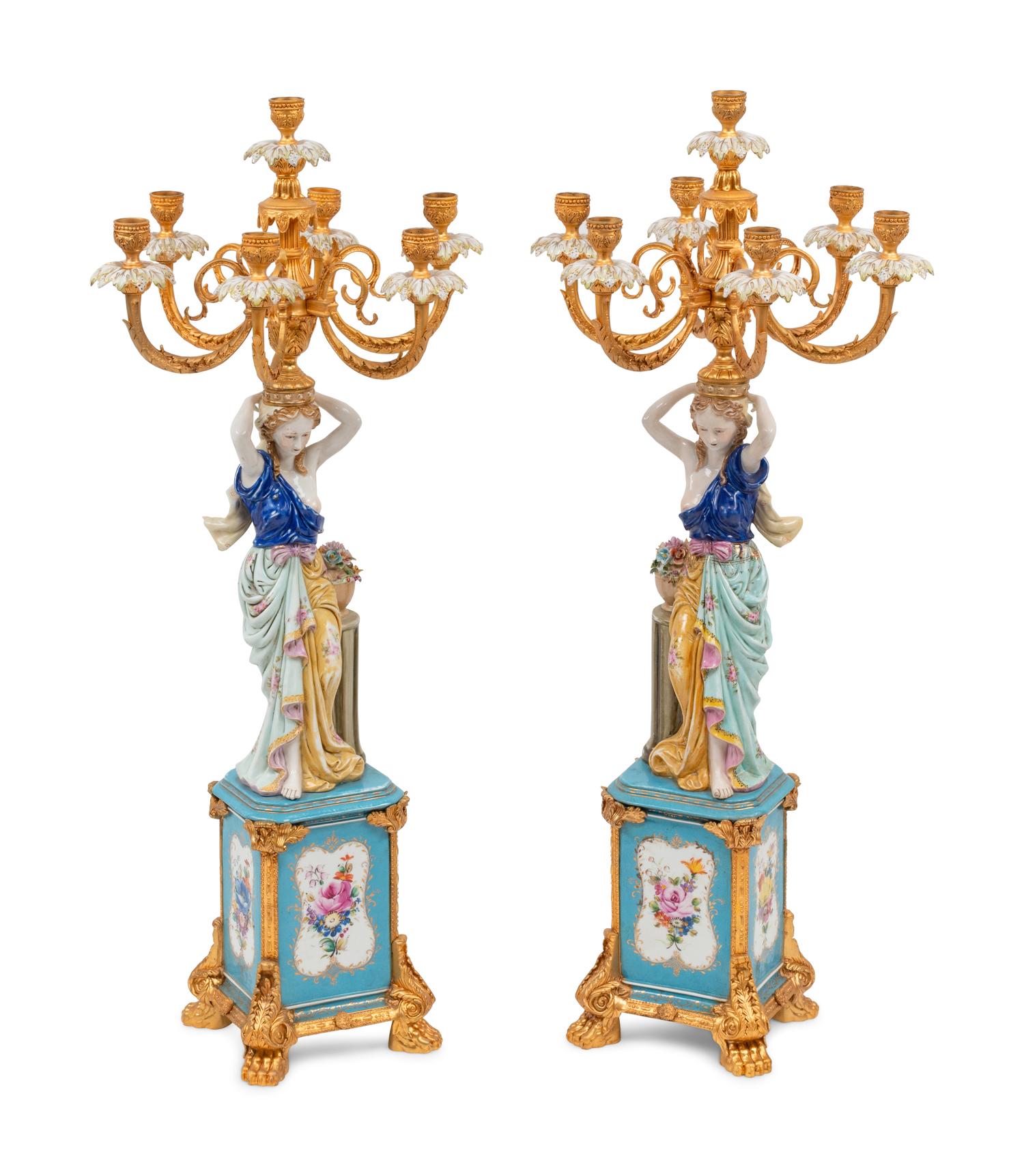 A Pair of German Porcelain and Gilt Bronze Figural Seven-Light Candelabra