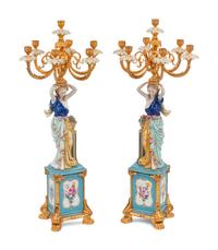 A Pair of German Porcelain and Gilt Bronze Figural Seven-Light Candelabra