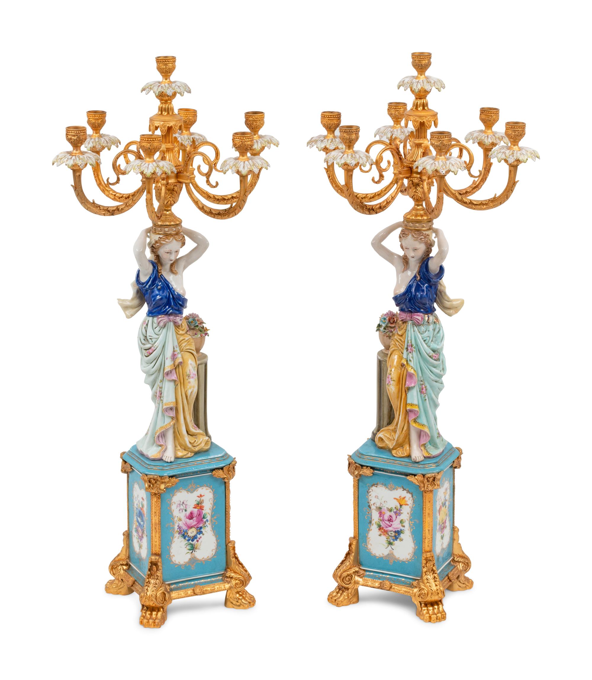 A Pair of German Porcelain and Gilt Bronze Figural Seven-Light Candelabra