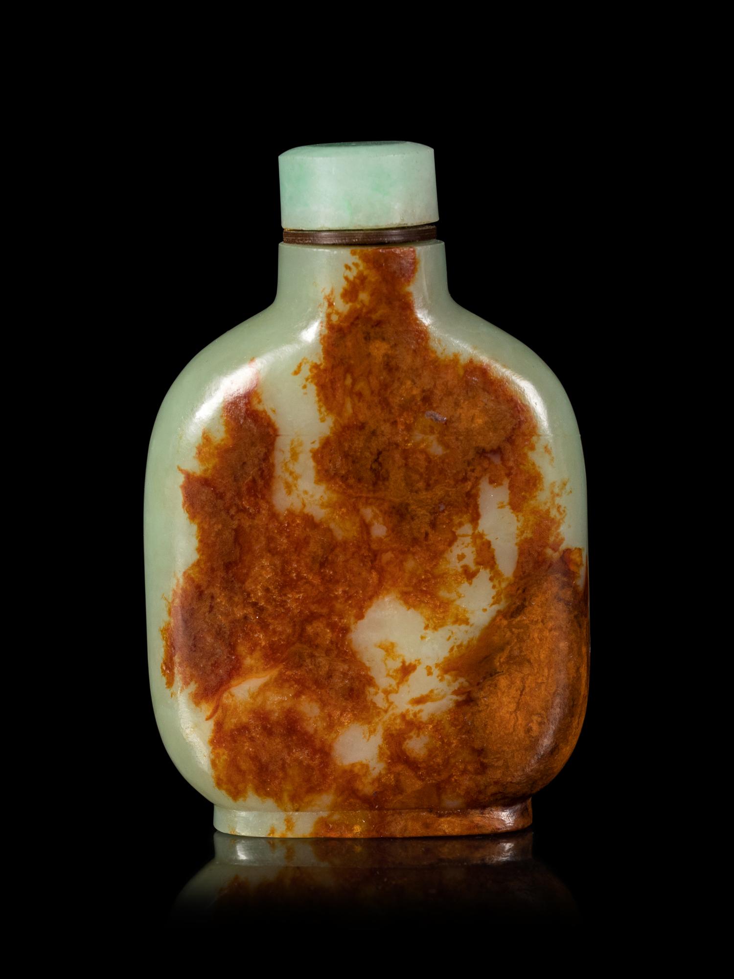 A Carved Celadon Jade Snuff Bottle