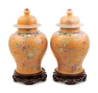 A Pair of Chinese Ochre Ground Famille Rose Porcelain Covered Jars