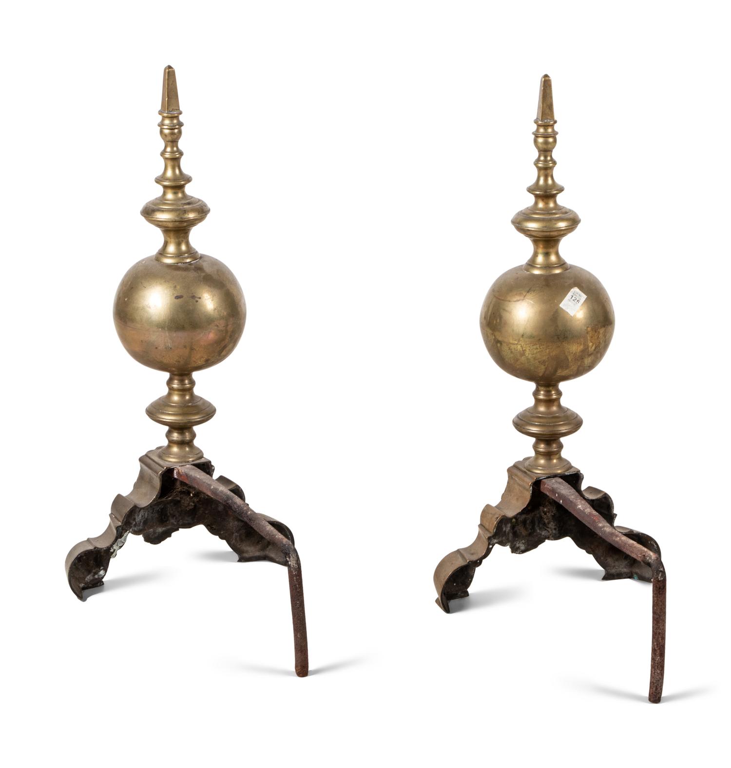 A Pair of Continental Brass Andirons with Masks