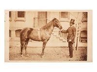 [AFRICAN AMERICANA - EARLY PHOTOGRAPHY]. CDV of an African American man with horse. Bellefonte, PA: J.W. Moore.