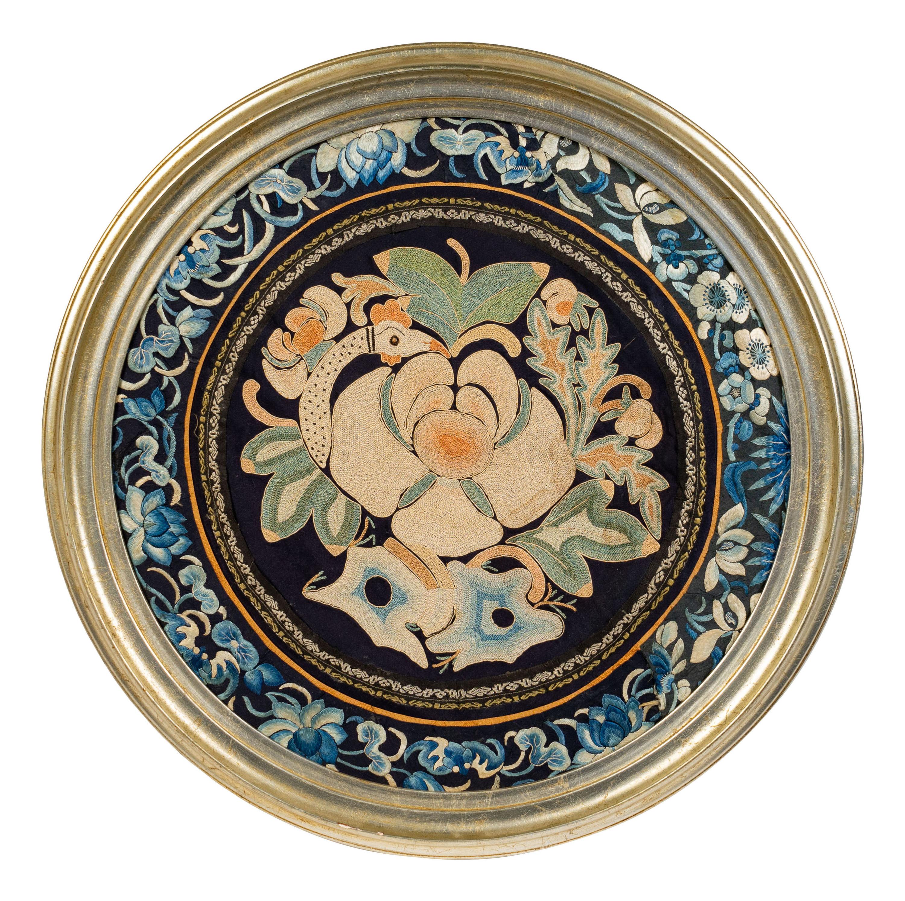 A Chinese Framed Blue Ground Embroidered Silk Panel Diameter 13 1/2 inches.