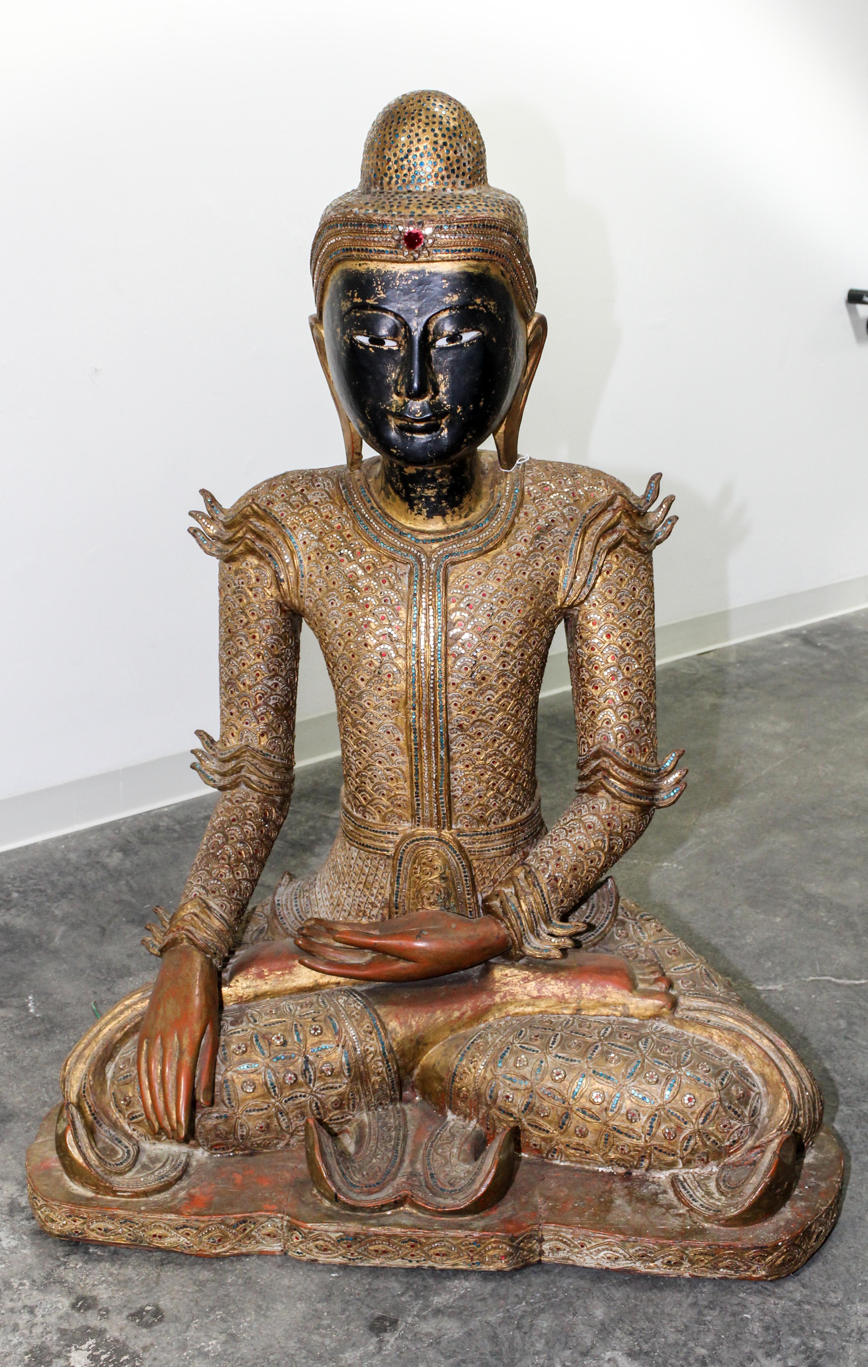 A Burmese Giltwood Seated Figure of Buddha Height 47 inches.