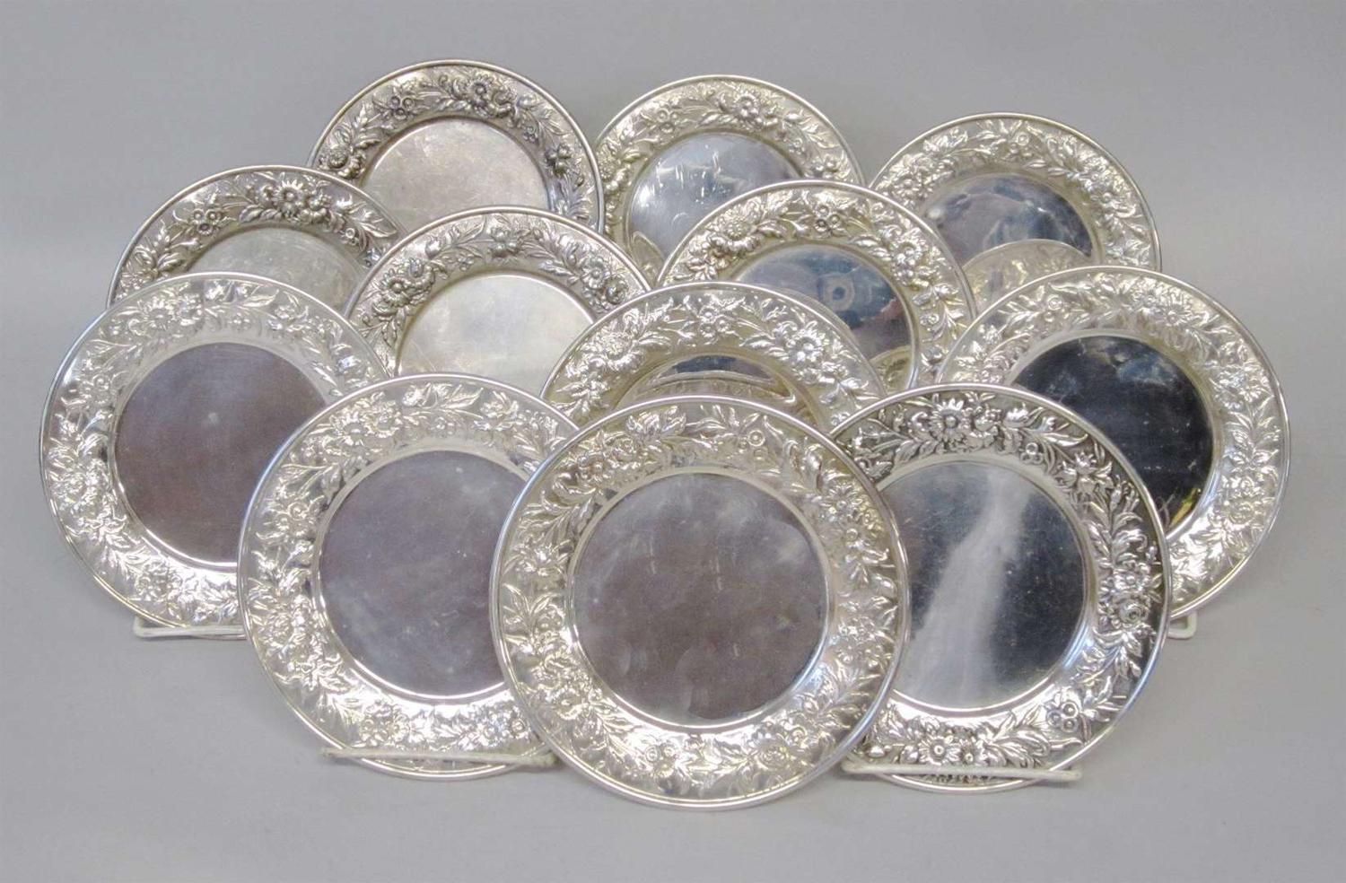 Set of twelve sterling silver repoussé bread plates s. kirk & son, baltimore, md, 20th century