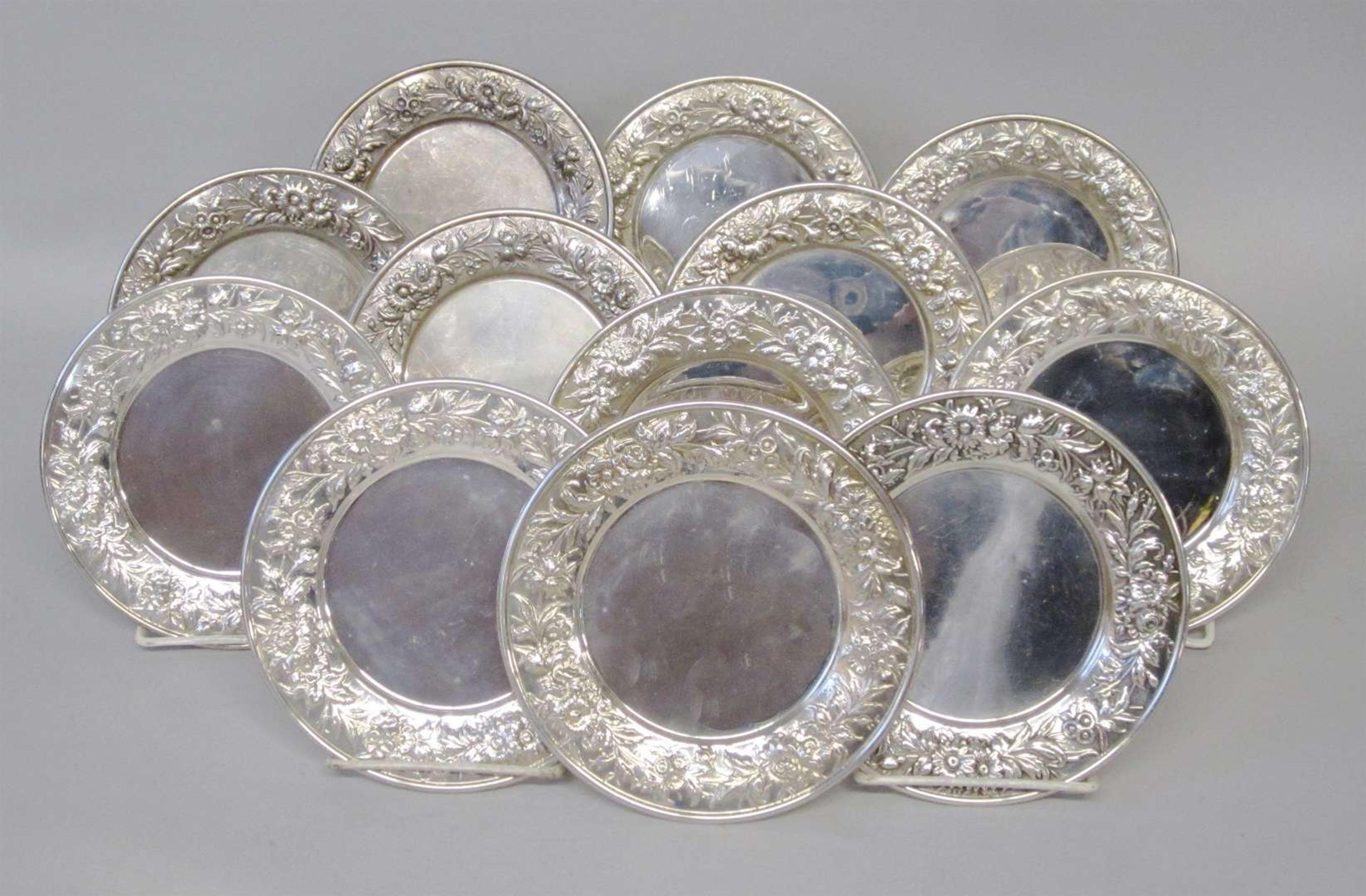 Set of twelve sterling silver repoussé bread plates s. kirk & son, baltimore, md, 20th century