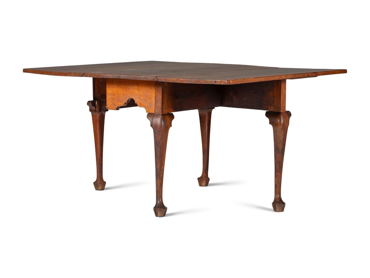 A Queen Anne Carved Walnut Drop-Leaf Dining Table