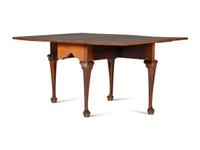 A Queen Anne Carved Walnut Drop-Leaf Dining Table