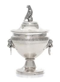 A Continental Silver Covered Sugar, 19th Century, the lid with a bird form finial, the body with mask ring handles.