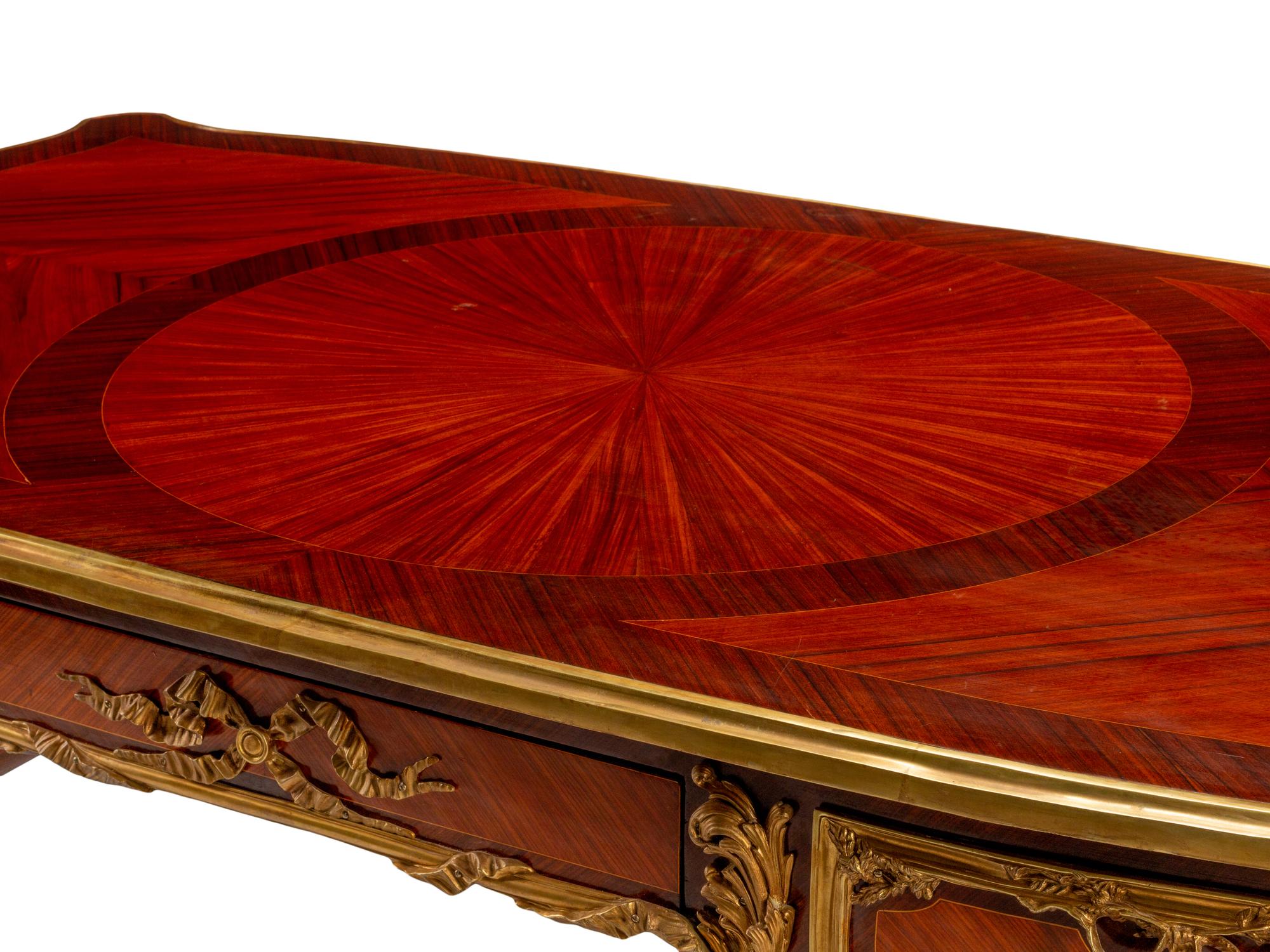 A Louis XV Style Gilt Bronze Mounted Kingwood and Plaque-Inset Bureau Plat