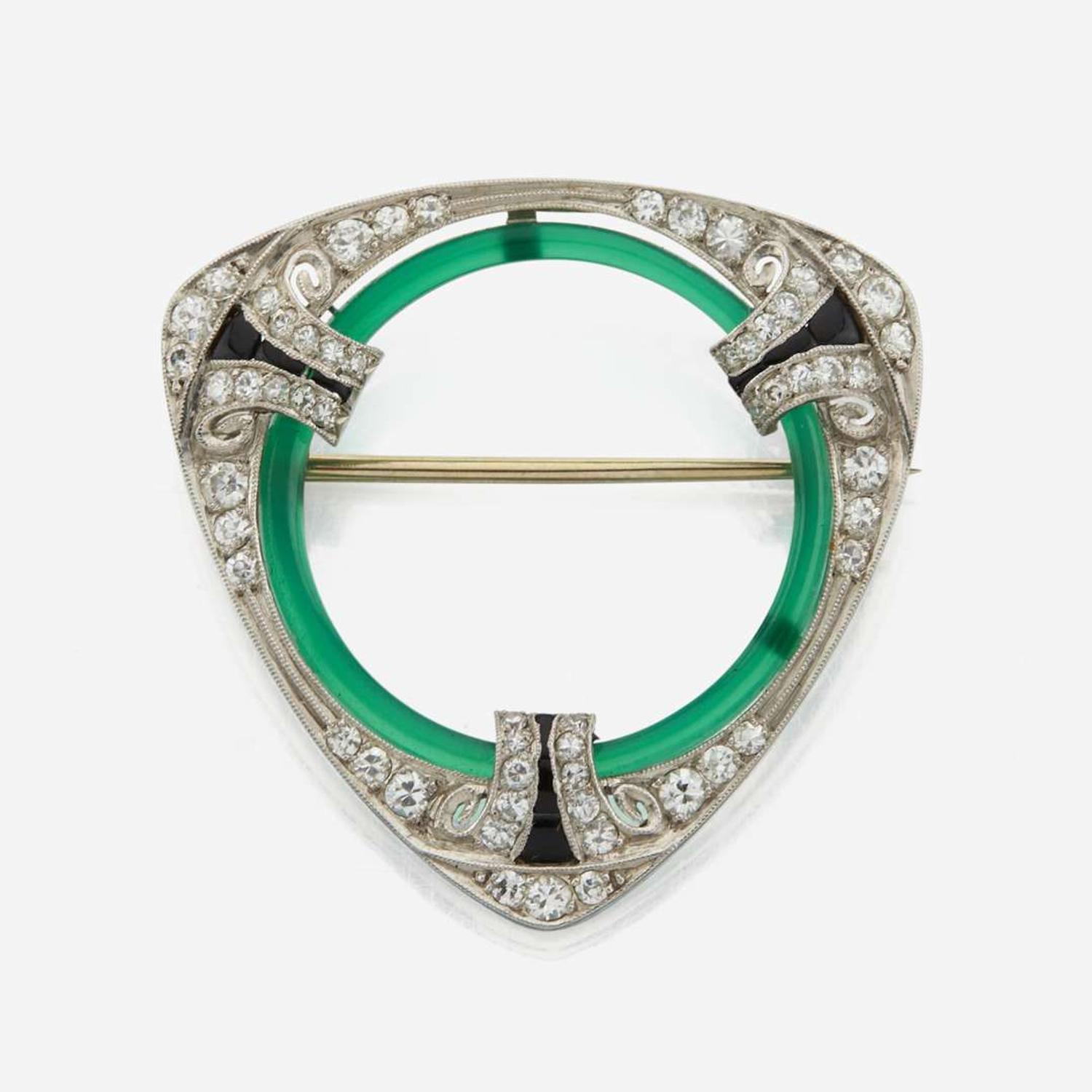 An Art Deco diamond, onyx, green glass, and platinum brooch