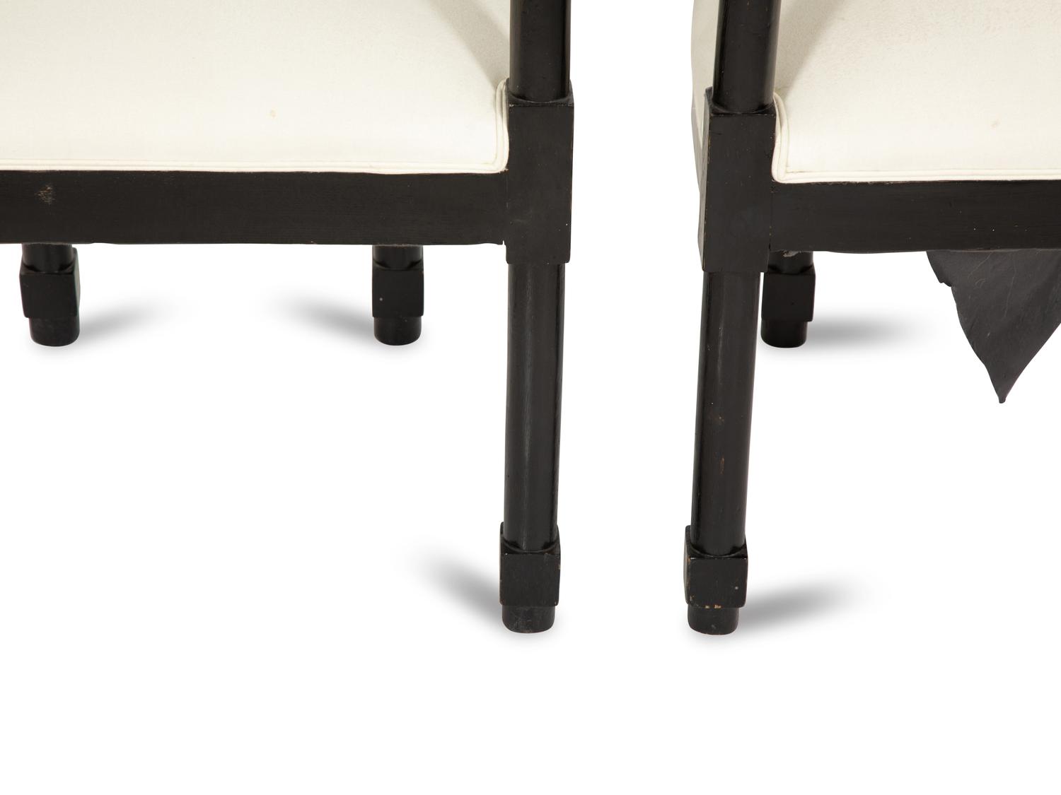 A Pair of Continental Ebonized Armchairs