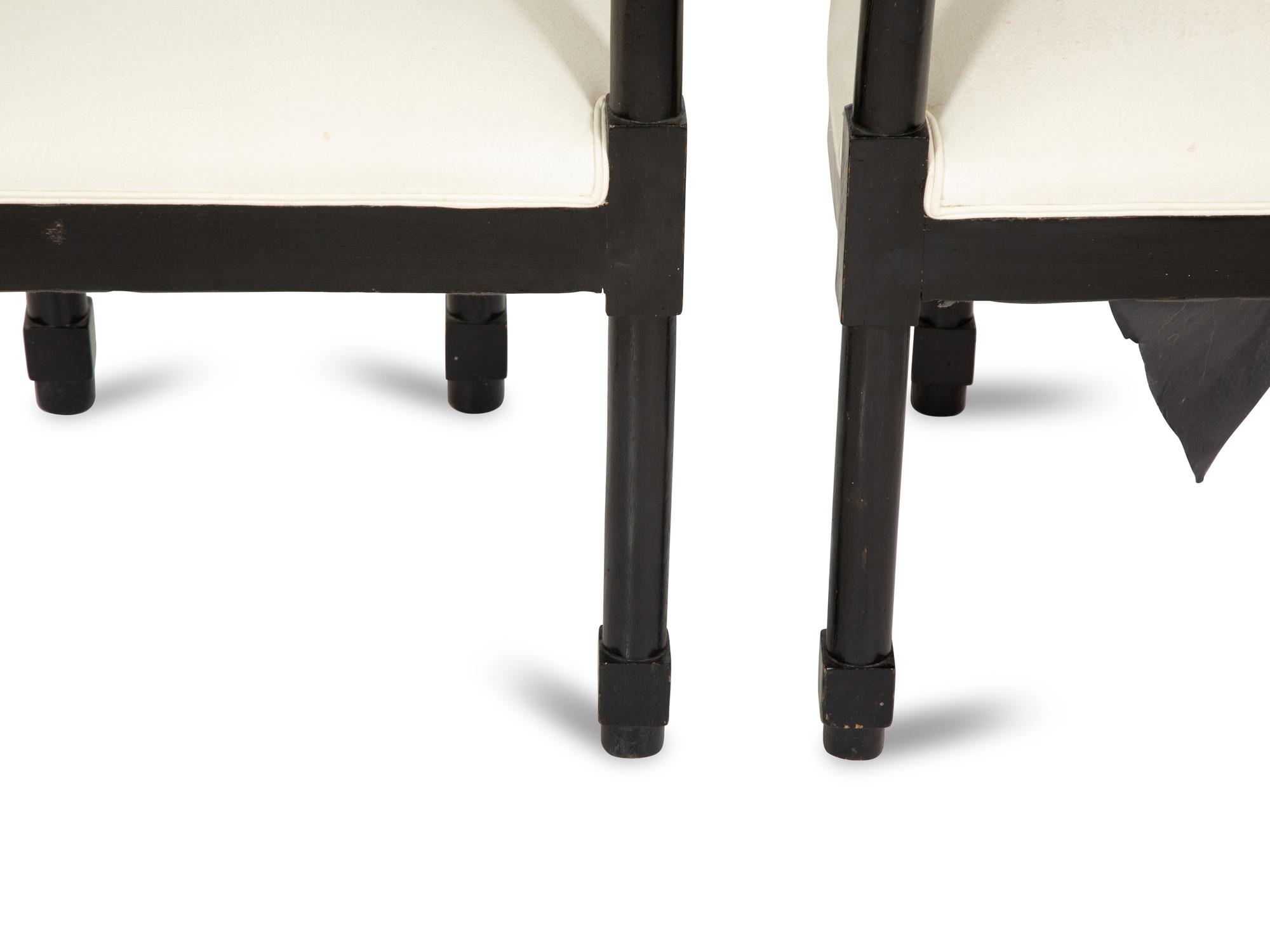 A Pair of Continental Ebonized Armchairs