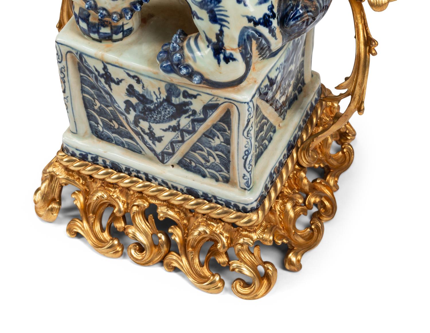A Pair of Large Gilt Bronze Mounted Porcelain Temple Lion Candelabra