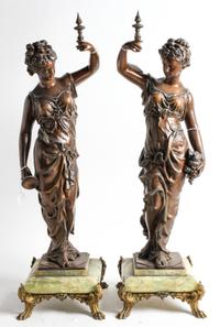 A Pair of Continental Cast Metal and Onyx Figures Height 28 inches. — EARLY 20TH CENTURY
