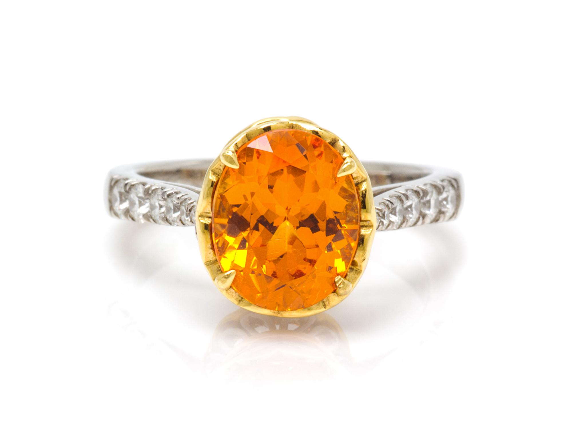 A Platinum, 18 Karat Yellow Gold, Spessartite and Diamond Ring, Richard Krementz, 5.40 dwts.
