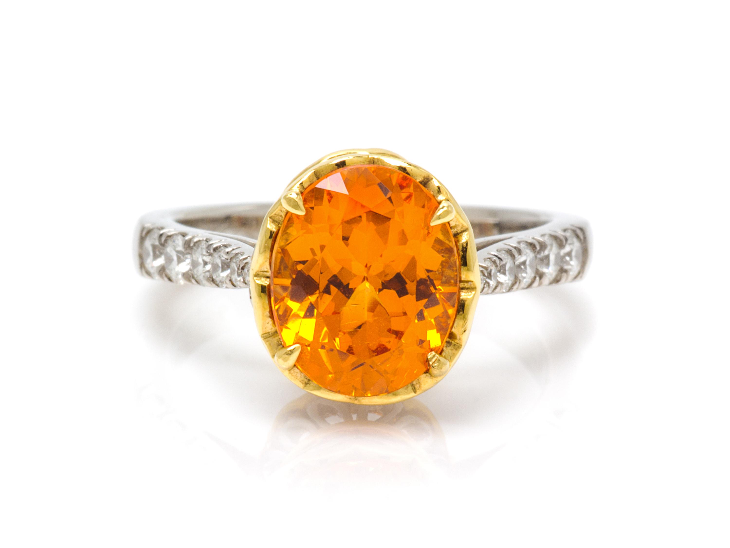 A Platinum, 18 Karat Yellow Gold, Spessartite and Diamond Ring, Richard Krementz, 5.40 dwts.