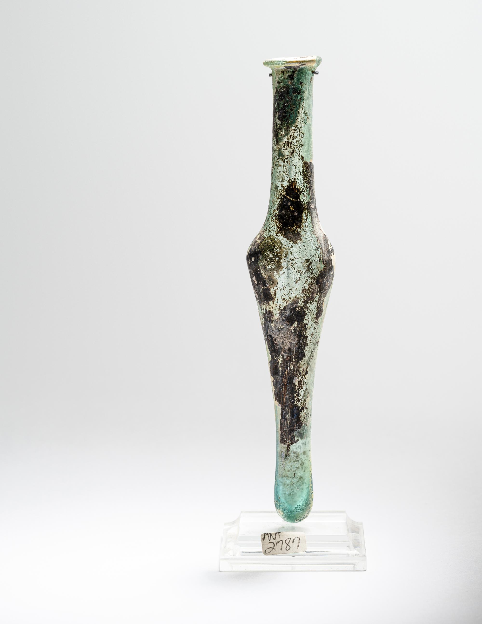 A Roman Pale Blue Glass Unguentarium