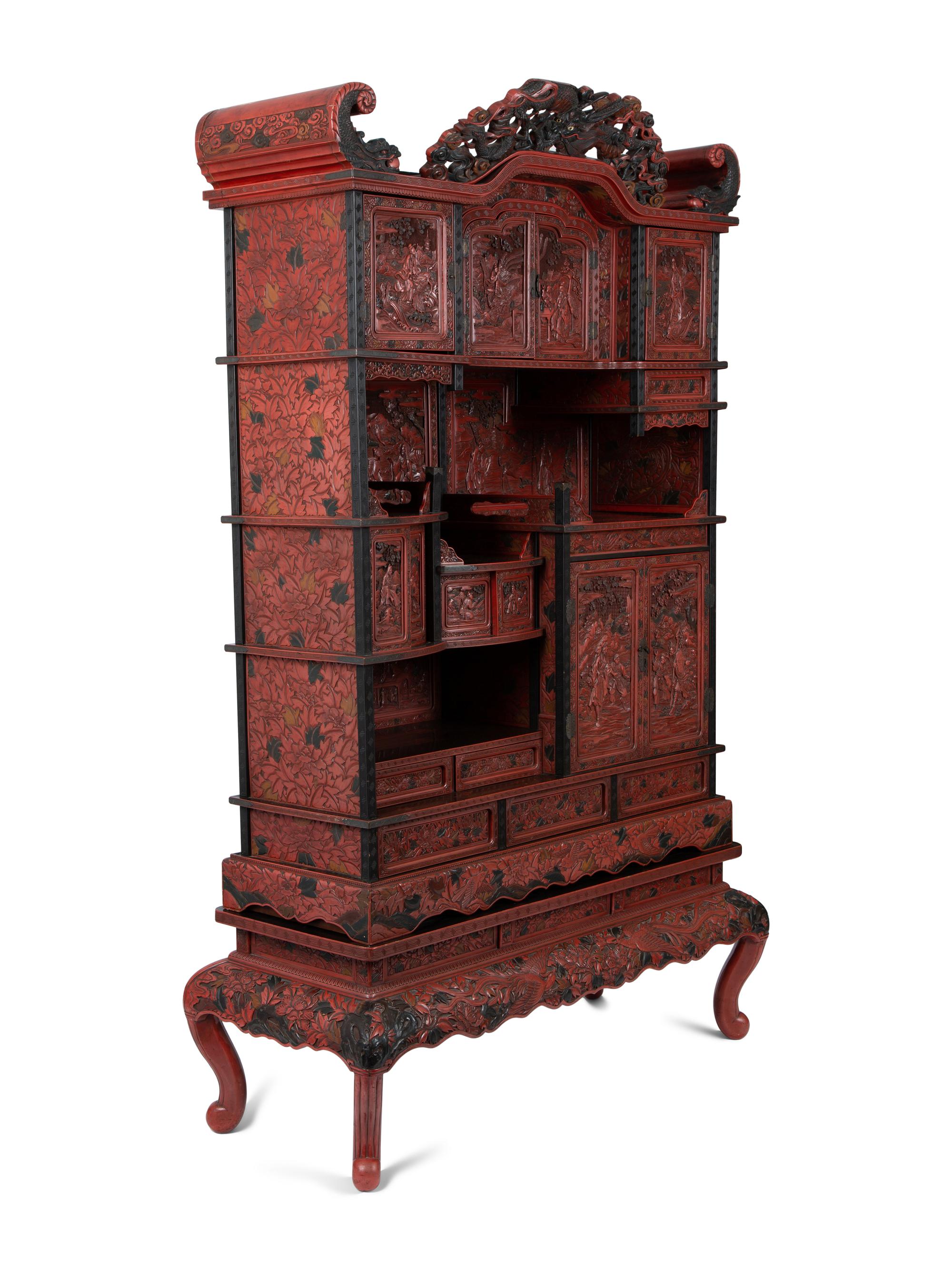 A Chinese Export Carved Red Lacquer Curio Cabinet — EARLY 20TH CENTURY